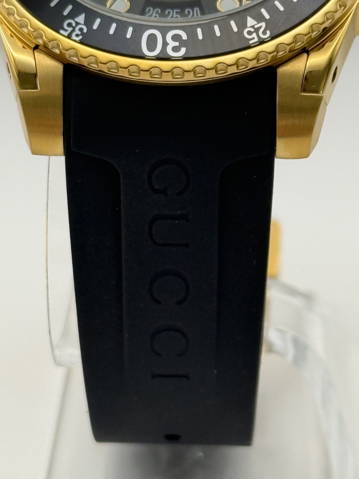 Gucci Dive Black Dial Gold-Tone Rubber Strap 45mm. Men’s Watch YA136219
