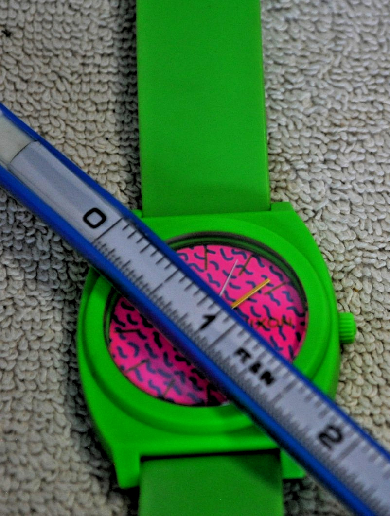 Nixon Time Teller P watch featuring a vibrant green polycarbonate case and strap