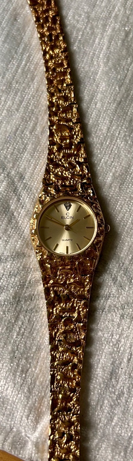 elgin 1 jewel myota co gold tone magnet band watch round face