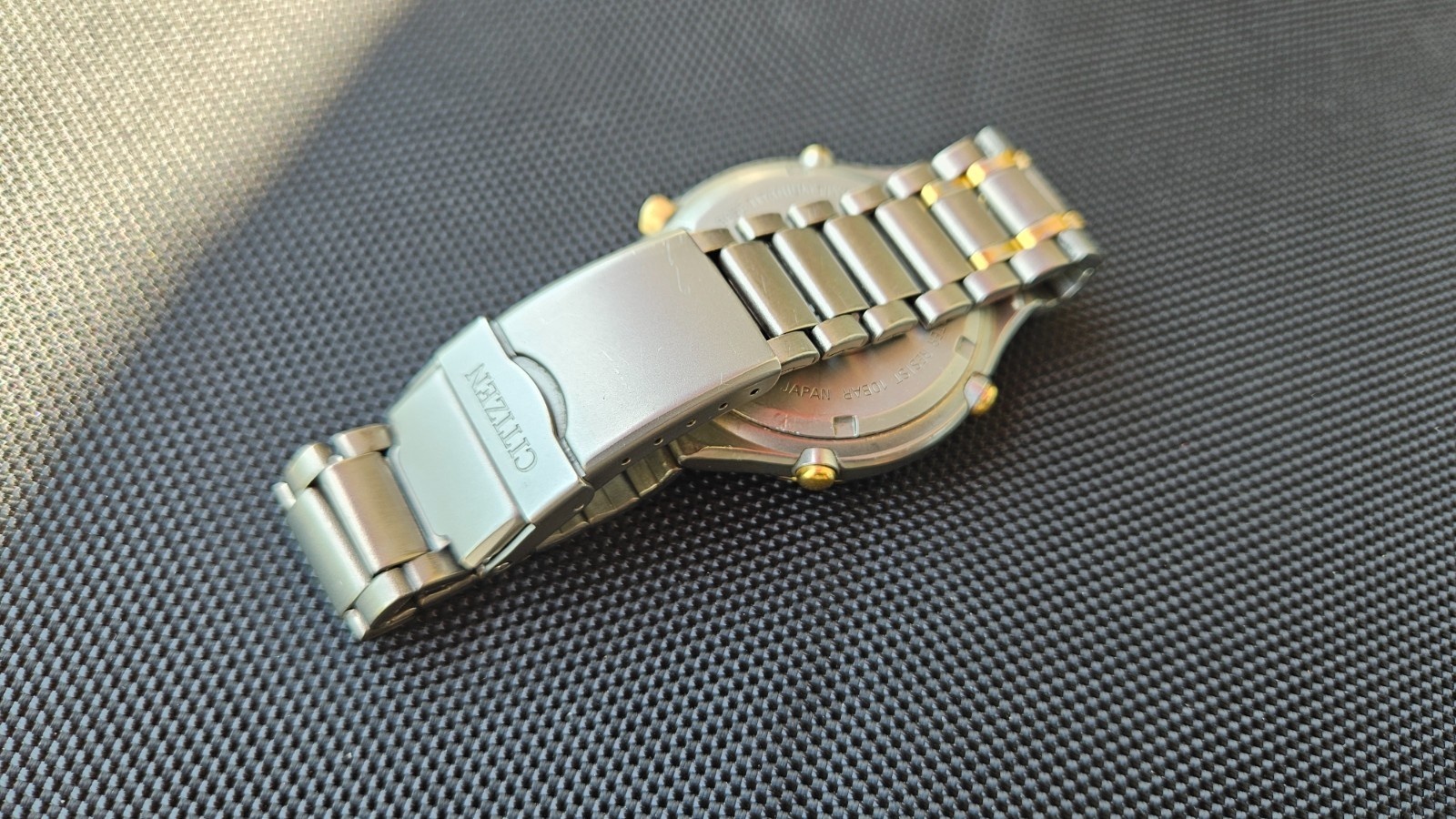 Citizen Promaster Pace Timer Titanium WR100 C130-089685 two-tone gold accents
