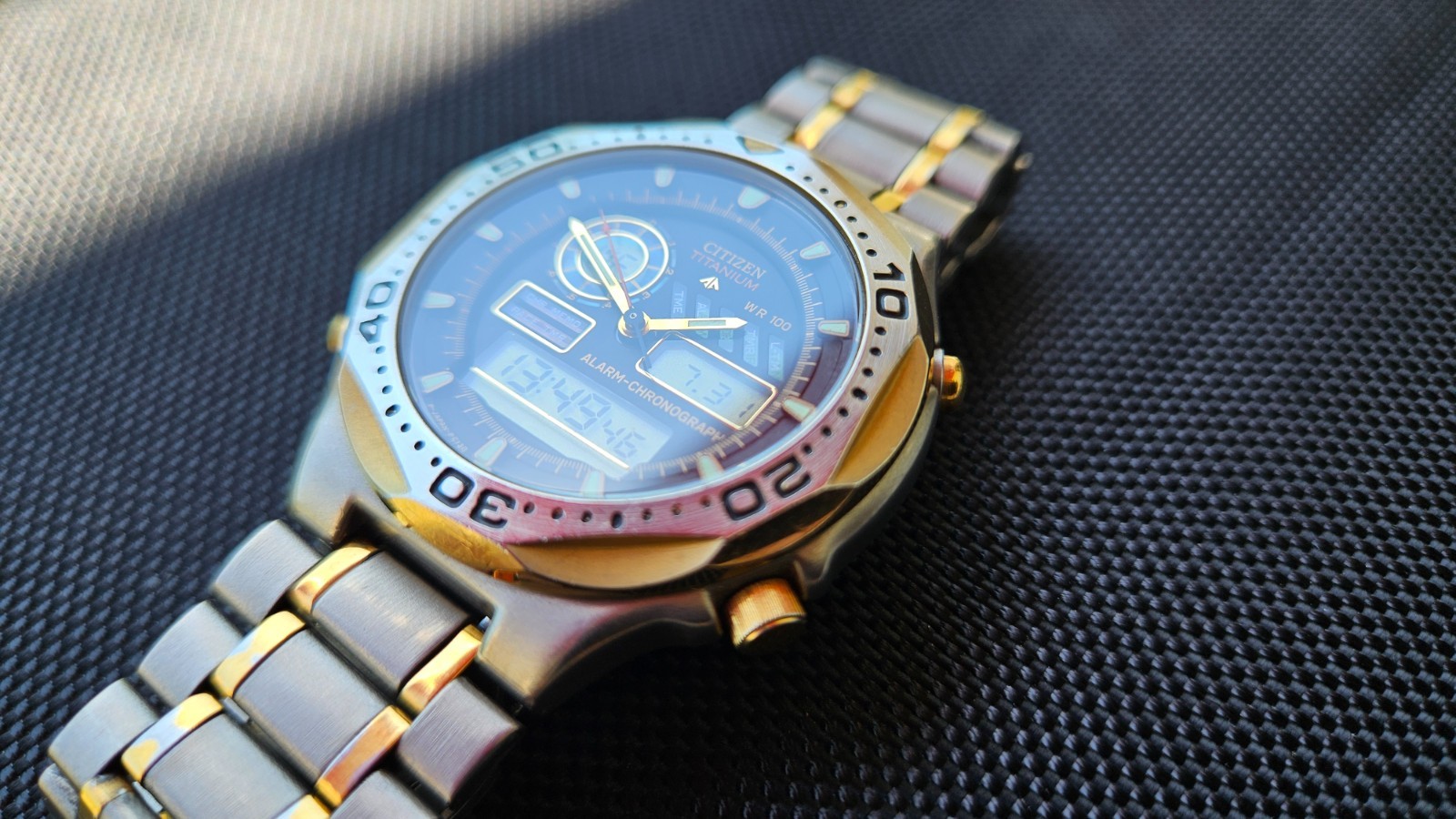 Citizen Promaster Pace Timer Titanium WR100 C130-089685 two-tone gold accents