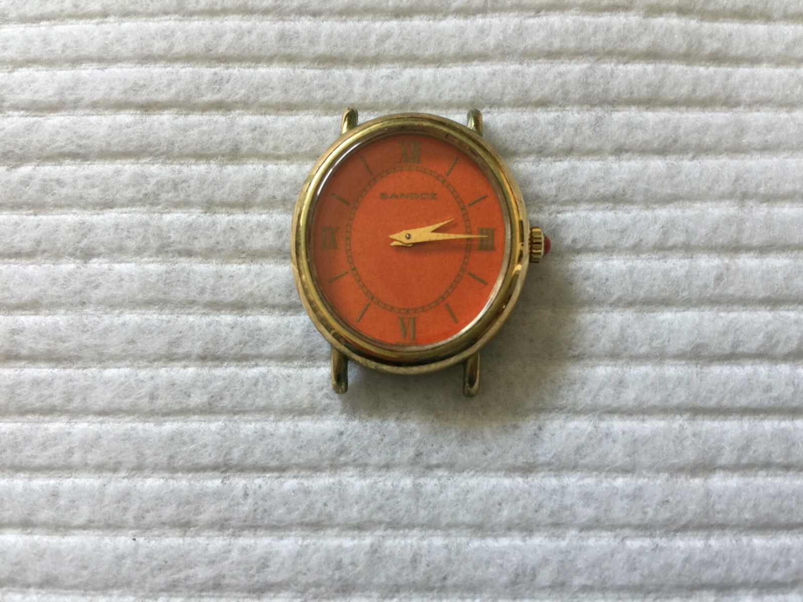 Sandoz Mechanical Wind Up Ladies Watch with an Orange Dial