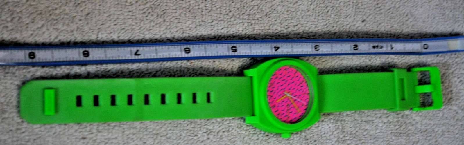 Nixon Time Teller P watch featuring a vibrant green polycarbonate case and strap