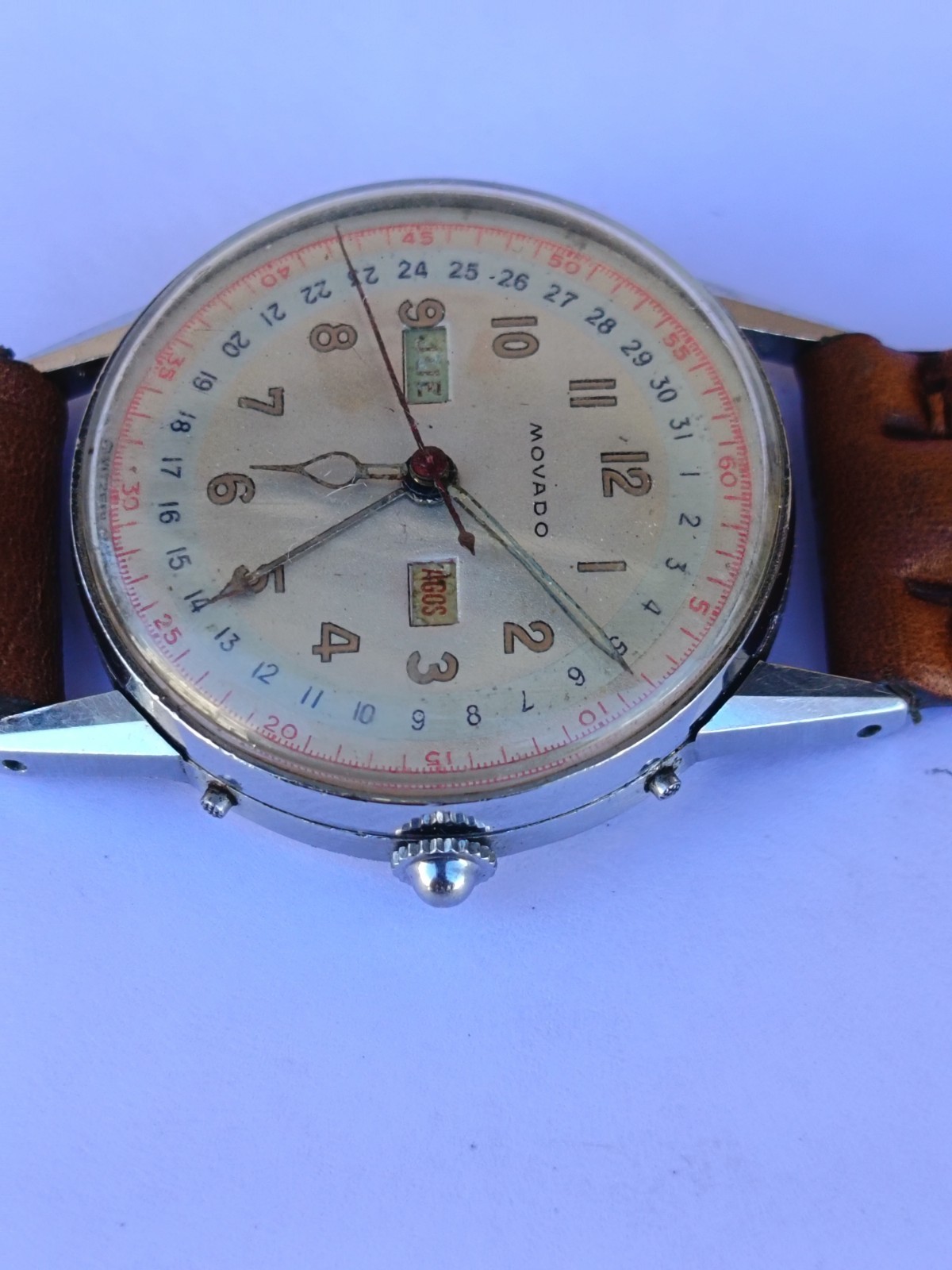VINTAGE MOVADO TRIPLE DATE. MANUAL WIND. MULTICOLOUR DIAL. RUNNING