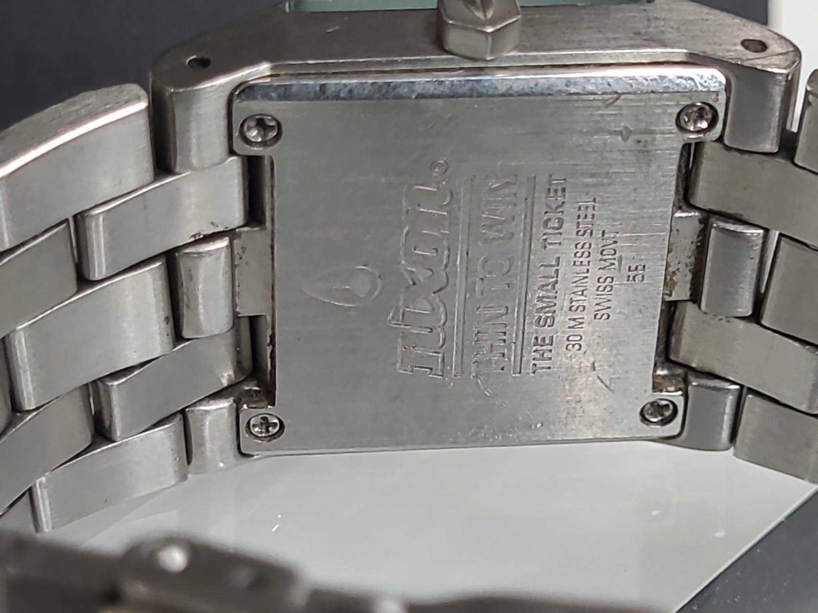 Nixon The Small Ticket “Thin To Win” Bronze/Silver Stainless Steel Swiss Mvmt.