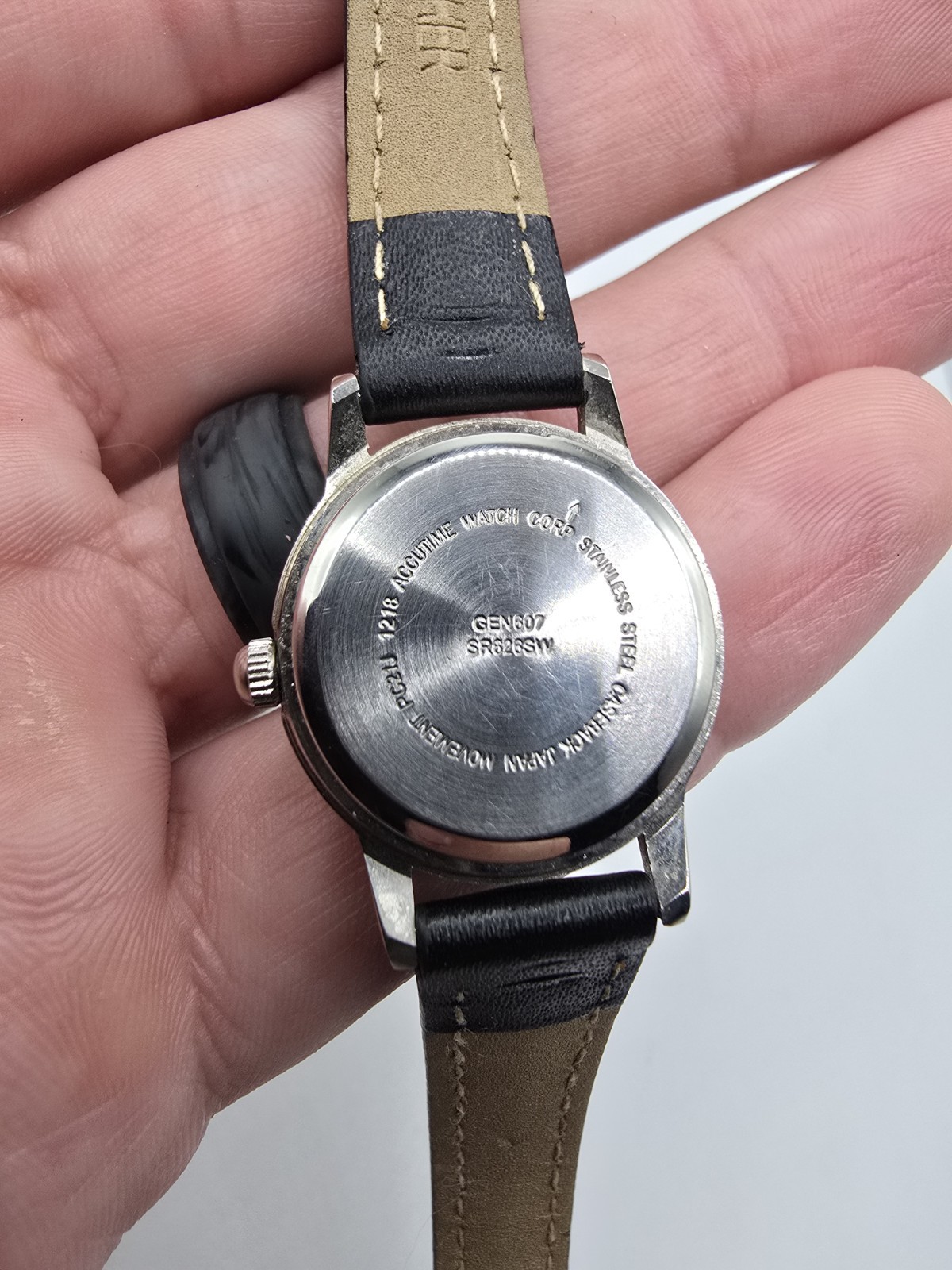 Accutime Quartz Analog Wristwatch White Dial Arabic Numerals Silver Case 26mm