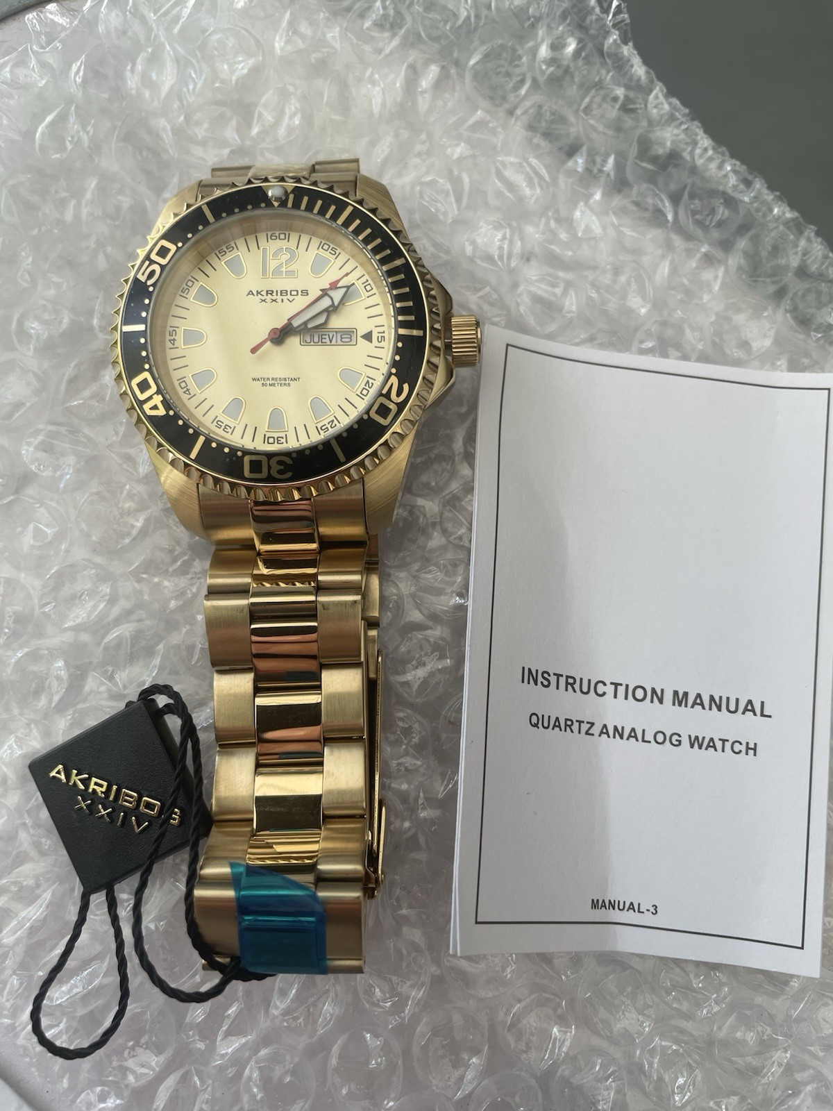 Akribos XXIV Men’s Quartz Diver Watch 46mm Gold Dial Black Bezel Day/Date 50m