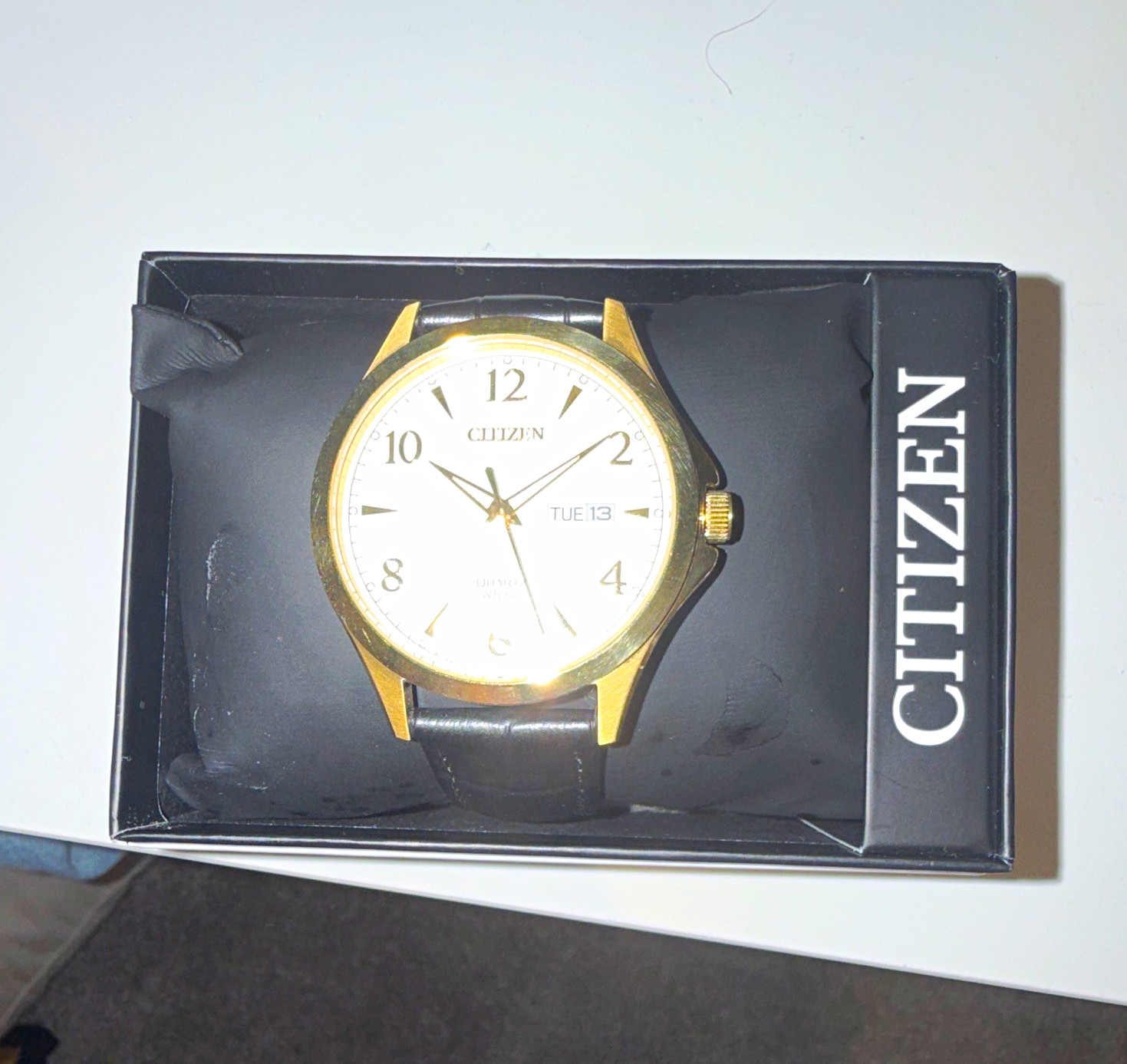 Citizen Quartz Men’s Day/Date White Dial Gold Case Black Leather Strap Watch