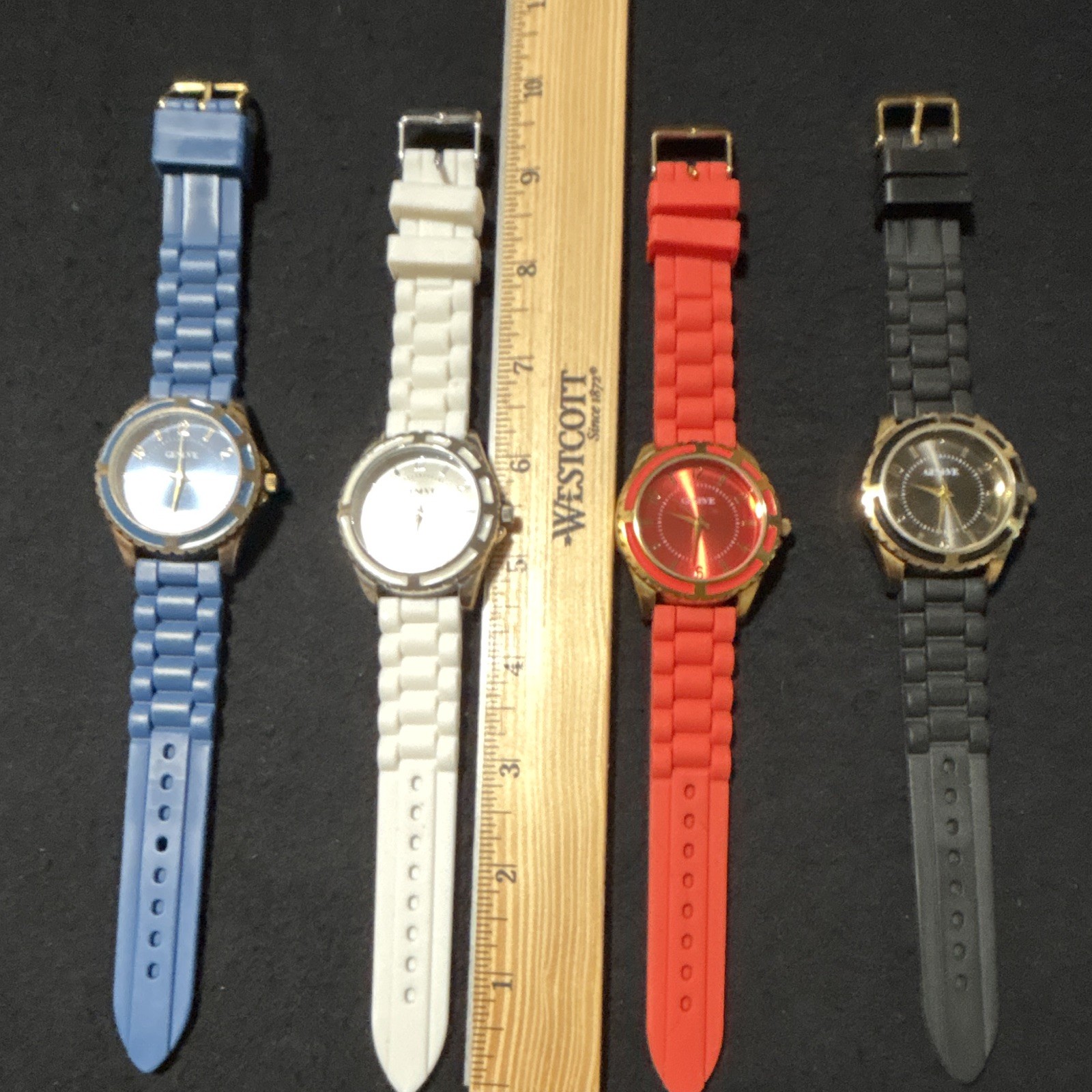 Geneve Lot of 4 Round Analog Watches Blue/White/Red/Black Rubber Straps