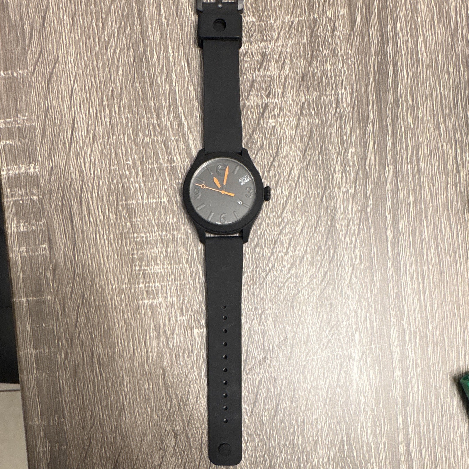 ESQ Movado Quartz Analog Wristwatch Black Silicone Band Gray Dial Orange Hands