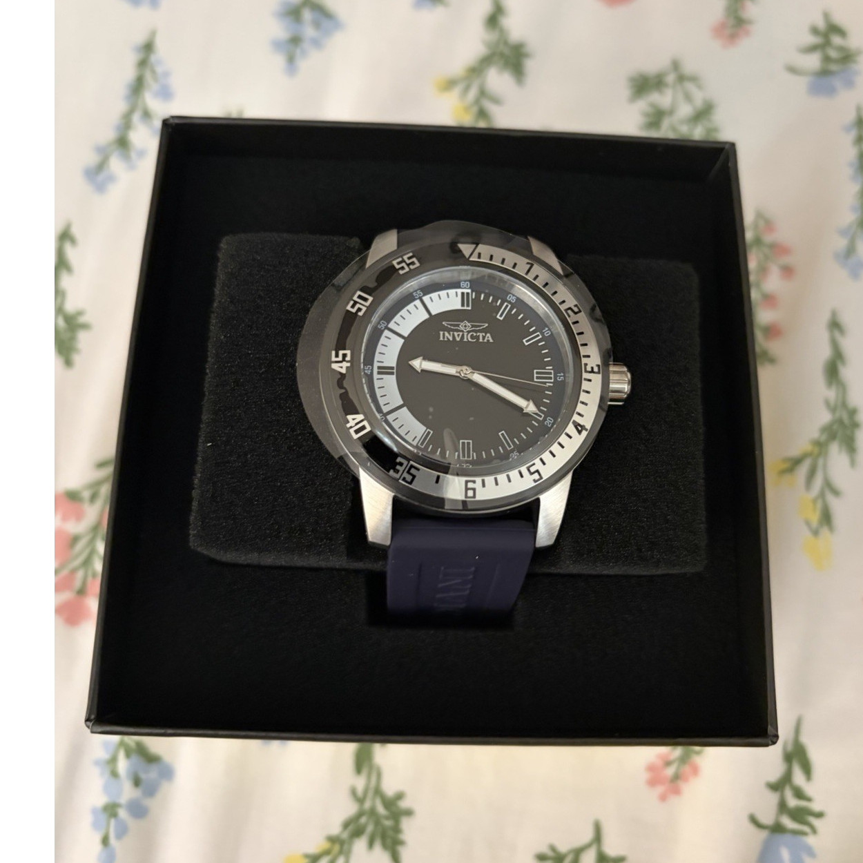 Invicta Men’s Black Dial Blue Band Silver Case Stick Indexes Wristwatch