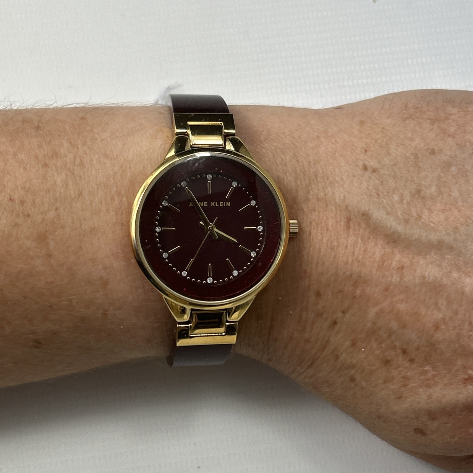 Anne Klein Women’s Quartz Burgundy Resin Gold-Tone Watch – AK/1408BYBY