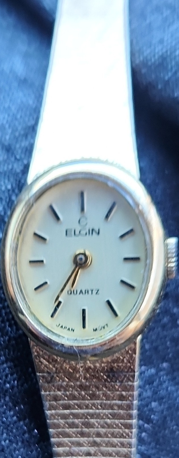 elgin quartz gold tone metal white dial stick indexes oval bracelet wristwatch