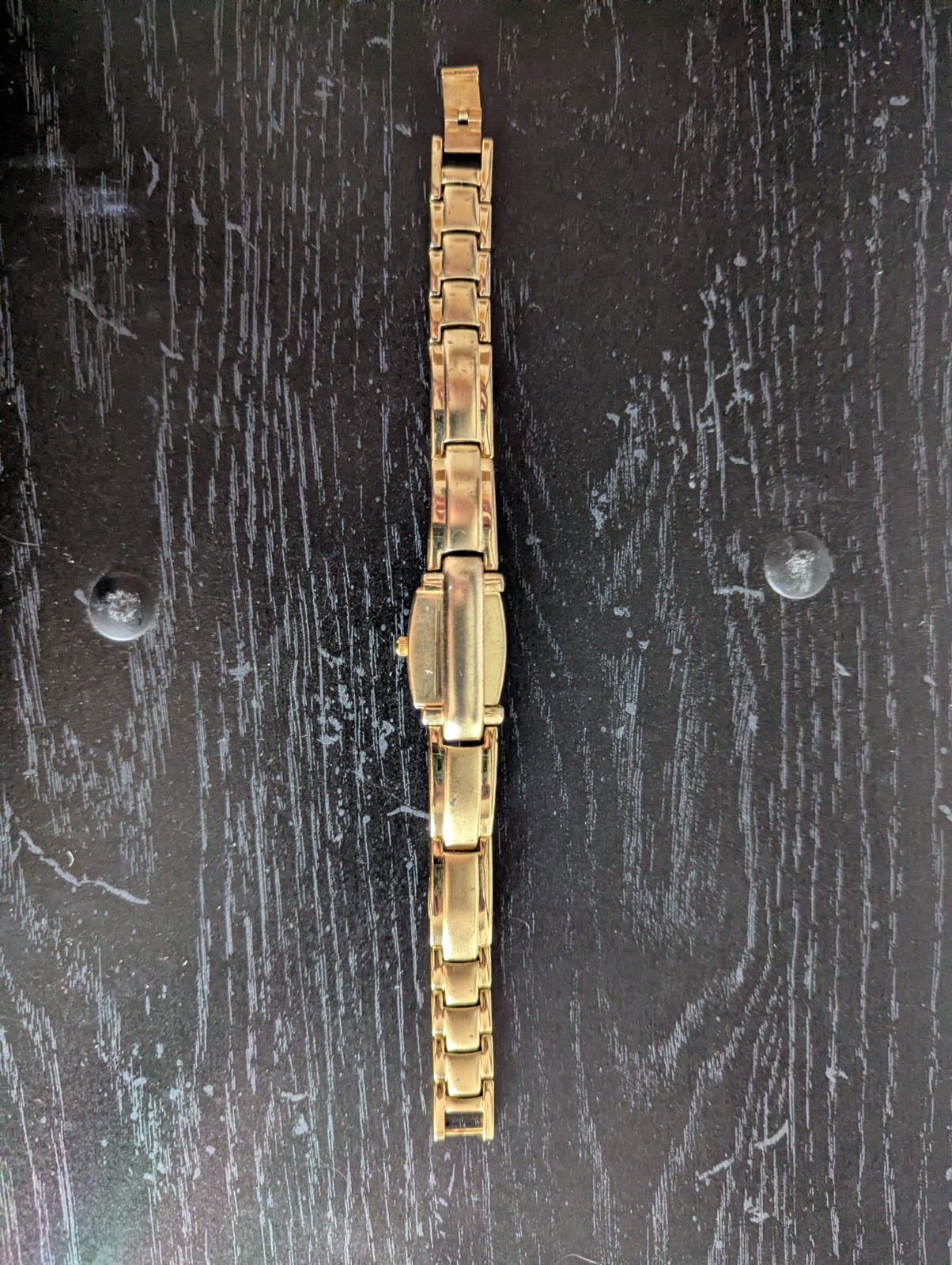 Gold plated watch by Royaltin with red crystal or Ruby not sure which. Very min