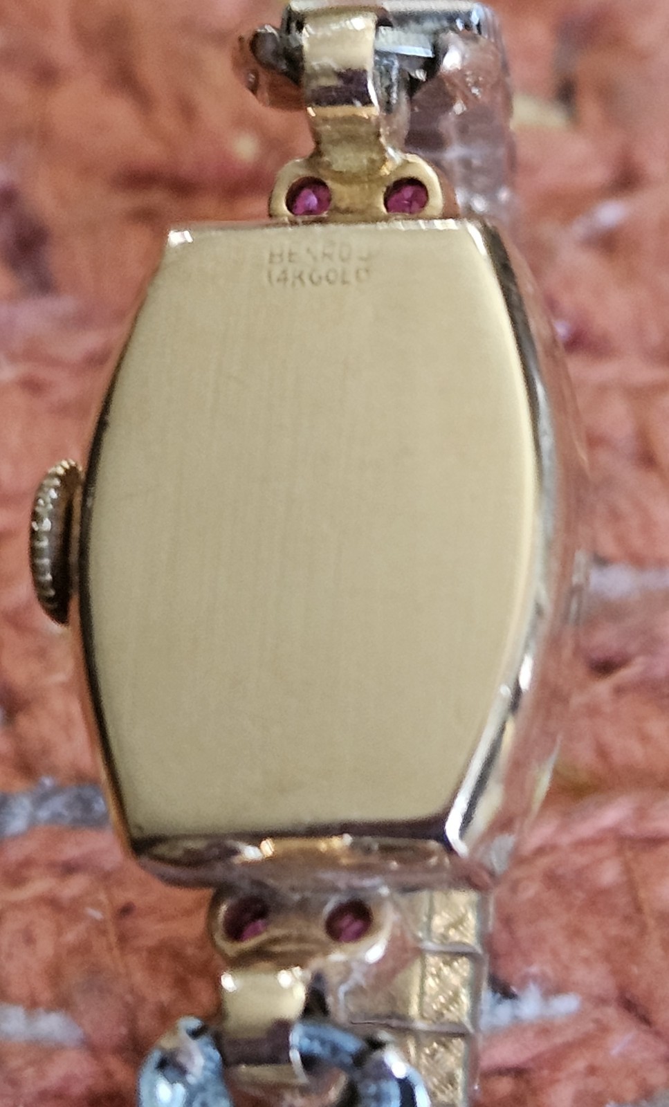VINTAGE 14 KT BENRUS ROSEGOLD LADIES WATCH WITH RUBIES AND DIAMONDS.