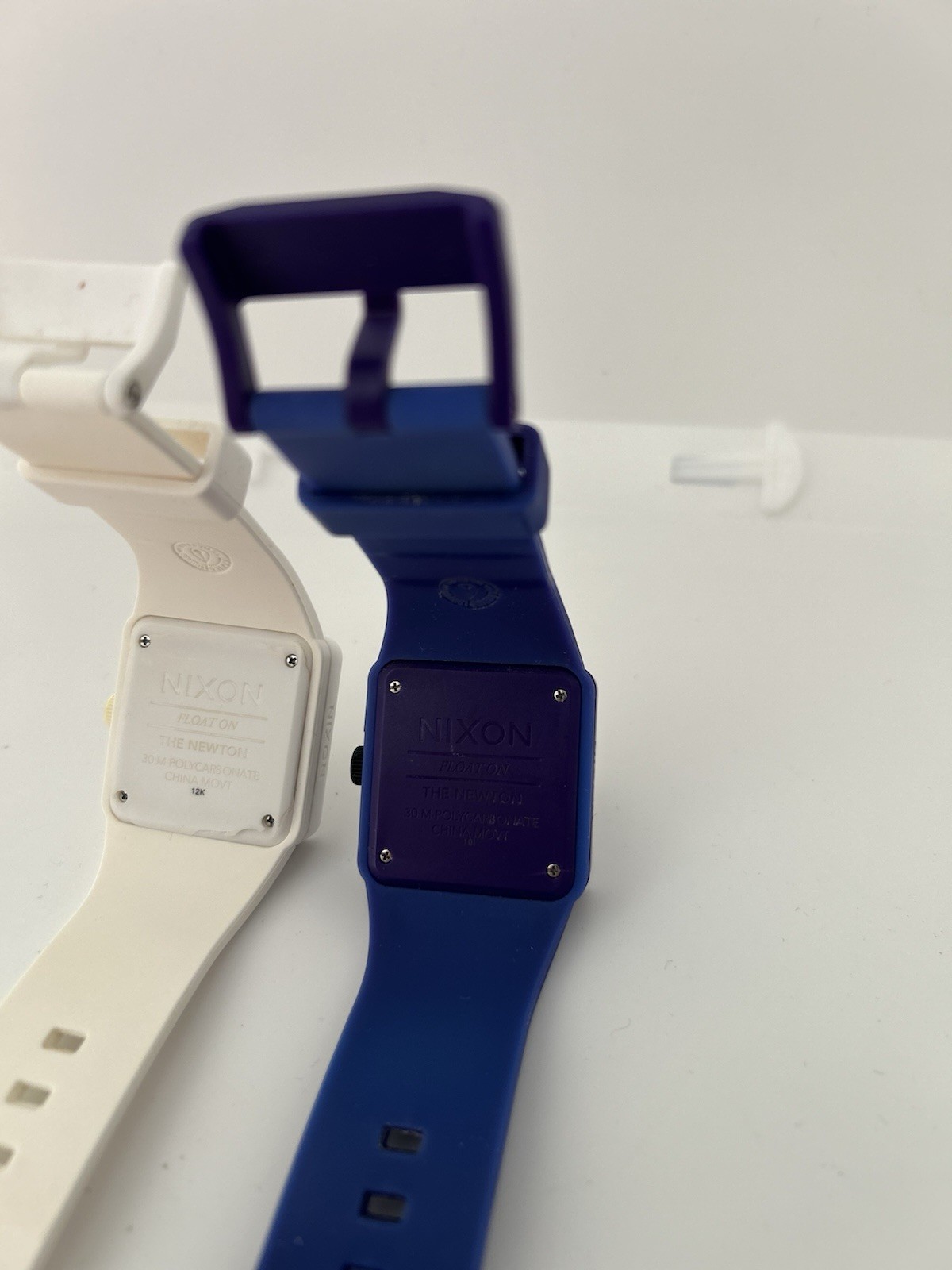 Two Nixon Float On The Newton Watch Purple And Blue And White