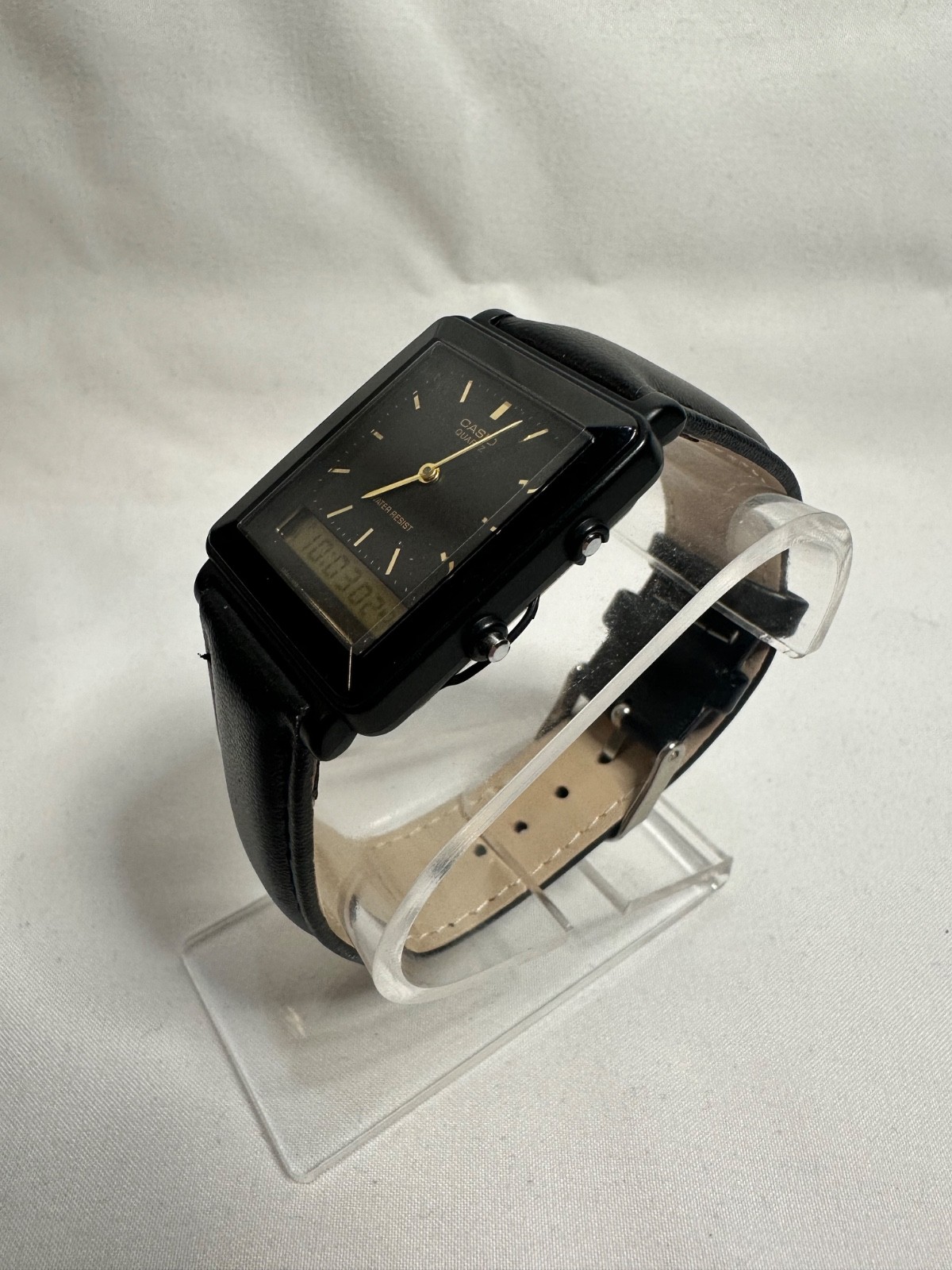 VINTAGE CASIO AQ-30 black face with gold accent leather band