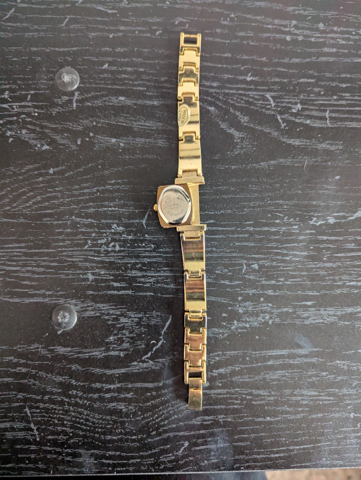 Gold plated watch by Royaltin with red crystal or Ruby not sure which. Very min