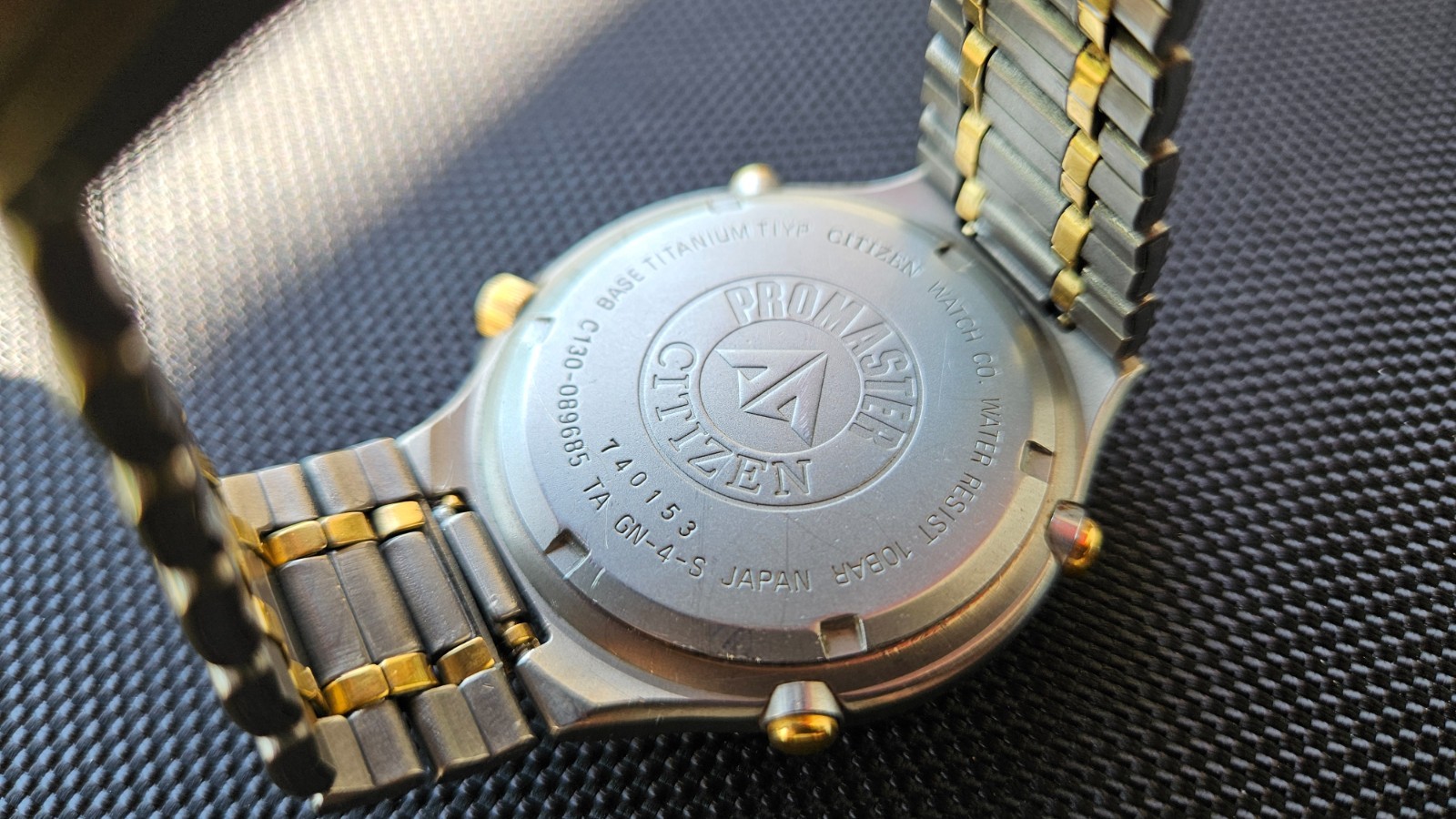 Citizen Promaster Pace Timer Titanium WR100 C130-089685 two-tone gold accents
