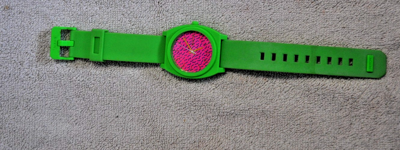 Nixon Time Teller P watch featuring a vibrant green polycarbonate case and strap