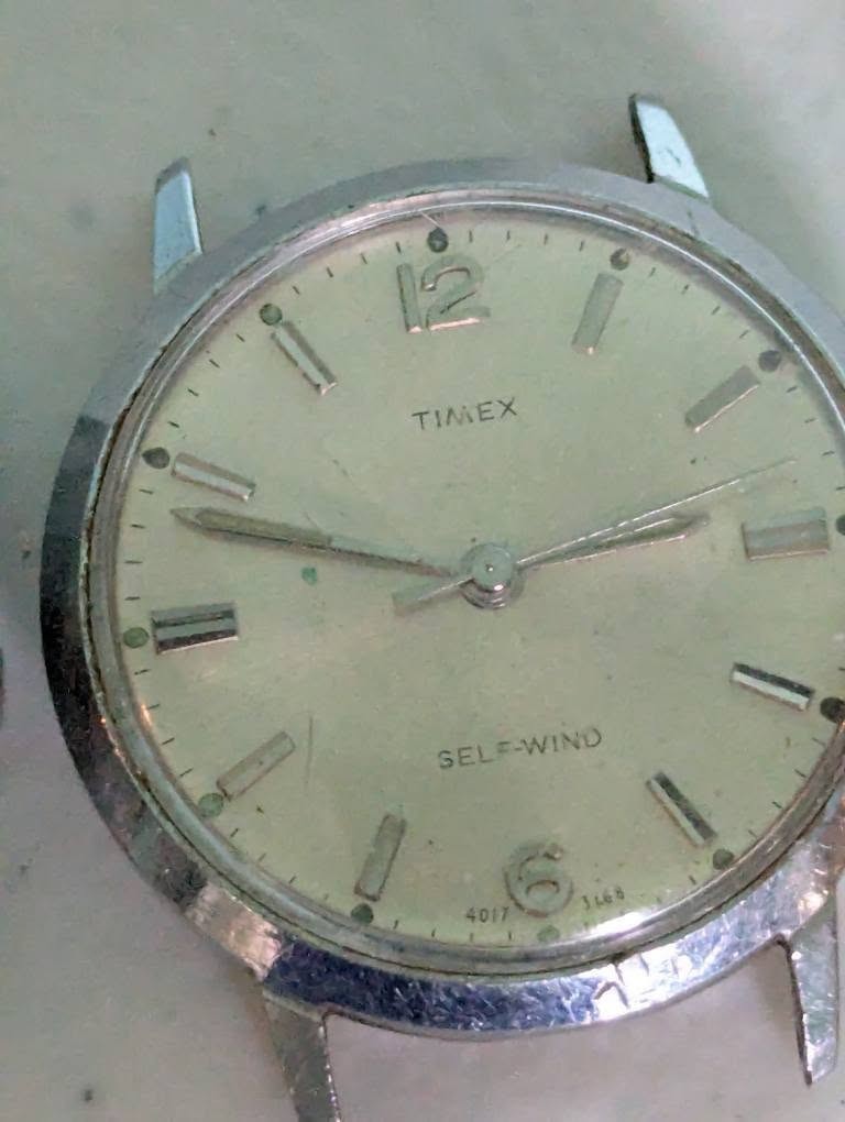 Lot of 4 watches no bands not tested for parts or repair