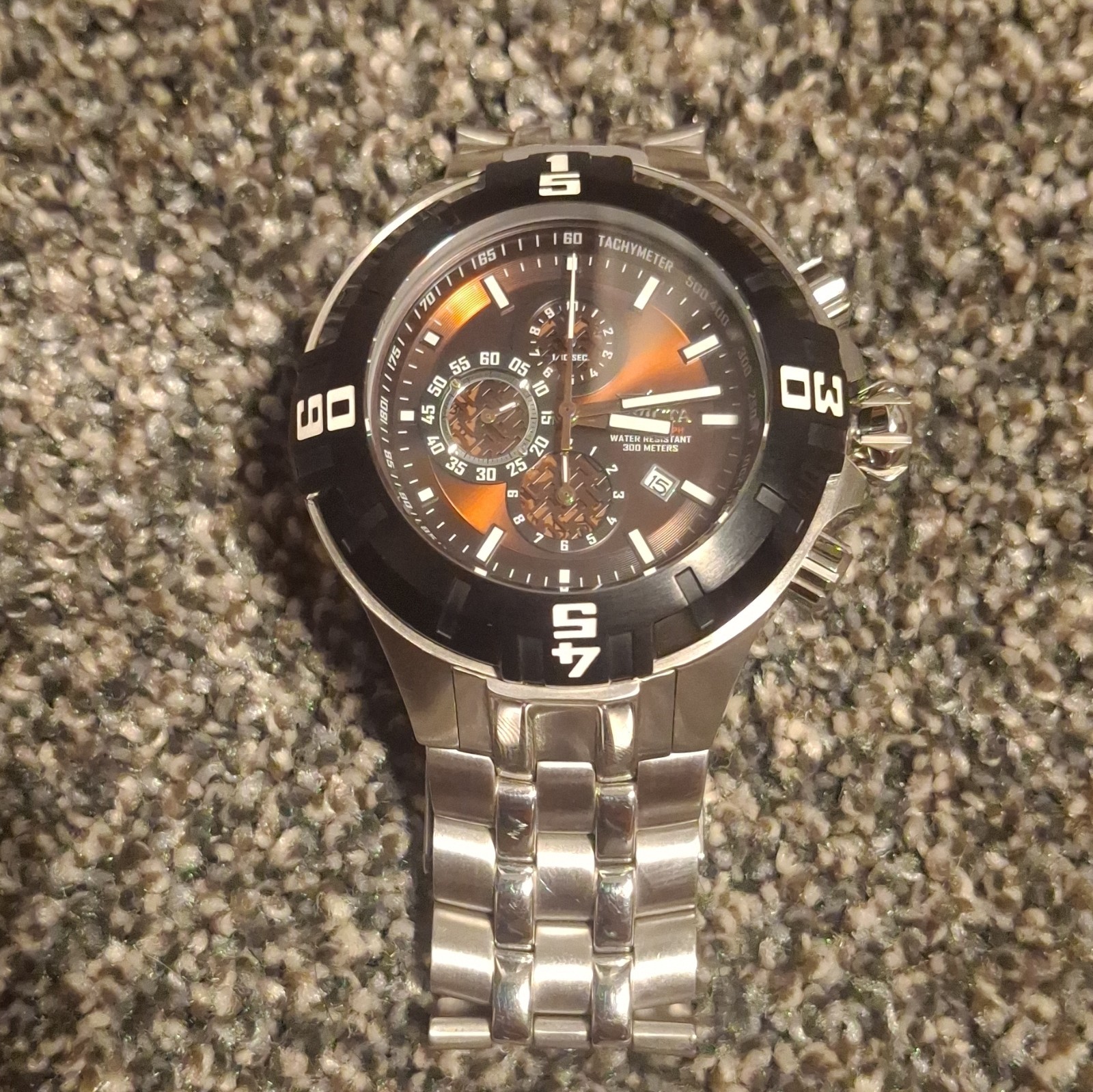 Invicta Men’s Quartz Chronograph 300m SS Black/Orange Dial Silver Bracelet