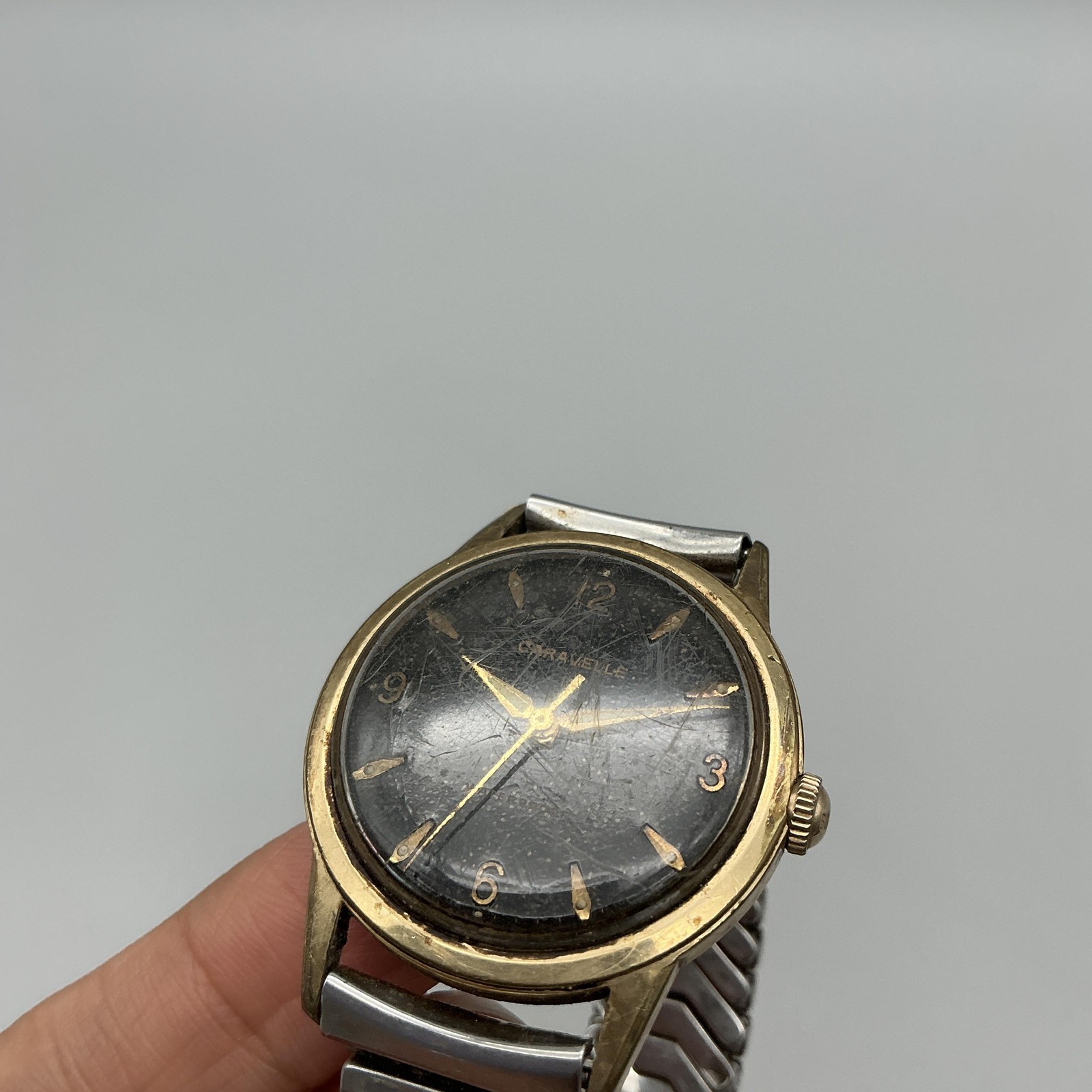 Vintage Caravelle Mens Watch 33mm Black Dial Gold Tone Stretch Band Manual Wind