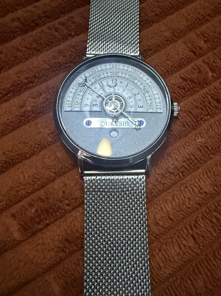 OUKESHI Orbit Dial Quartz Watch Mens Moon and Stars Pointer Steel Mesh Band