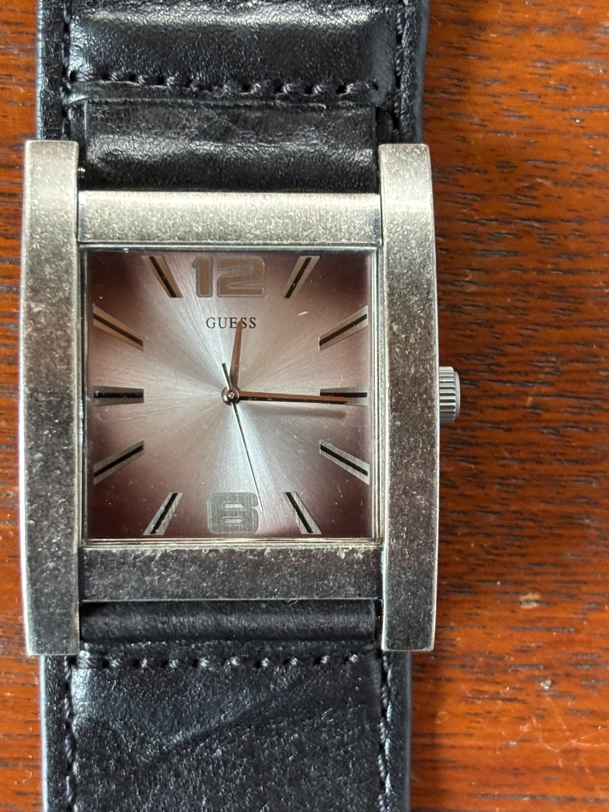 GUESS BRUSHED AGED SILVER TONE,BLACK LEATHER CUFF BAND WATCH U75016G1