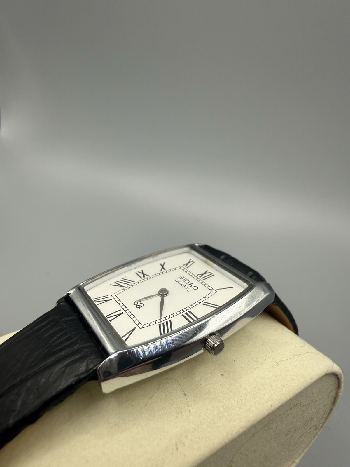 Seiko Quartz Vintage Dress Tonneau Silver Case White Roman Dial Black Leather