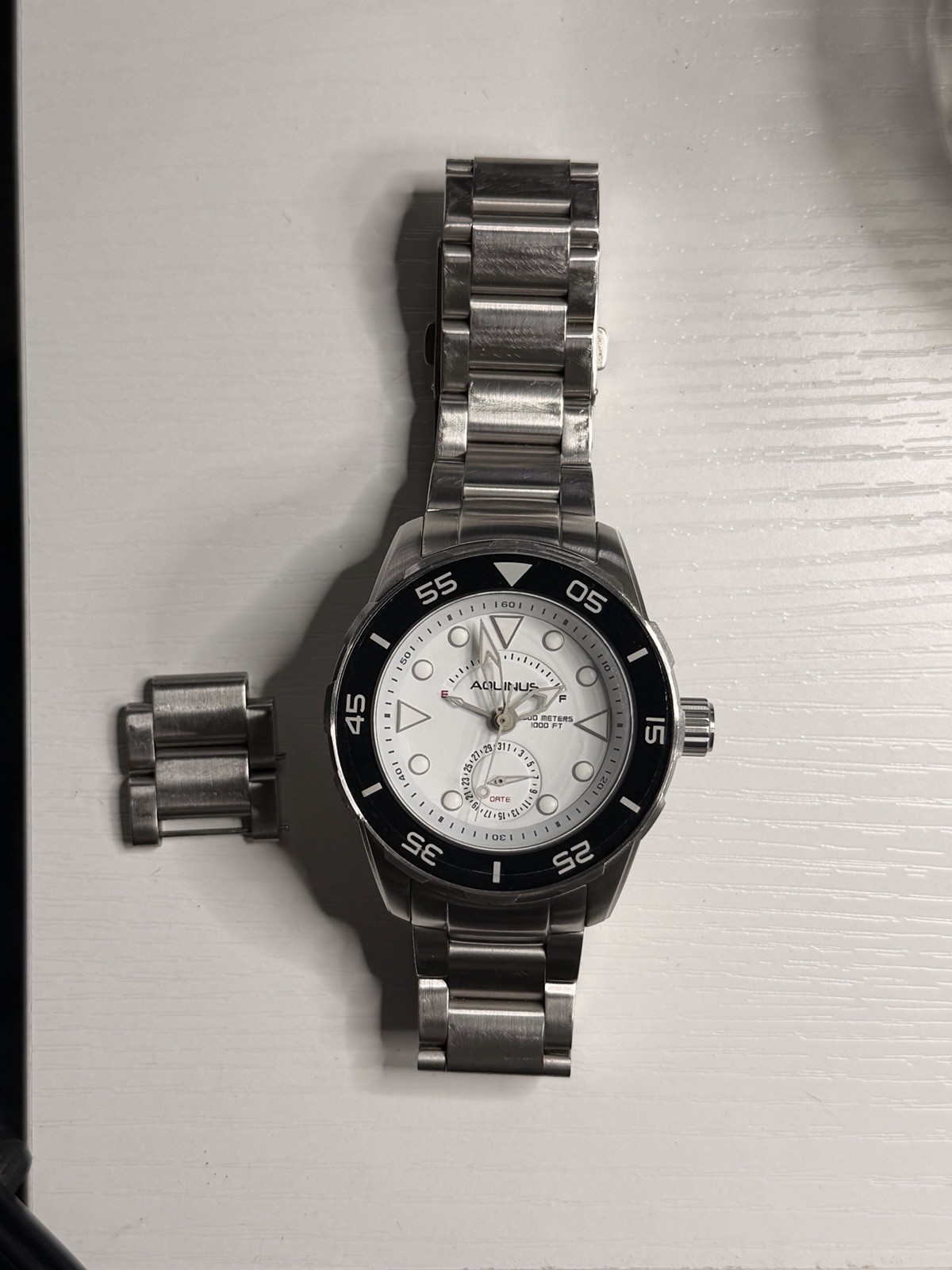 Aquinus Men’s Diver Quartz Date White Dial Black Bezel Steel Watch 300m