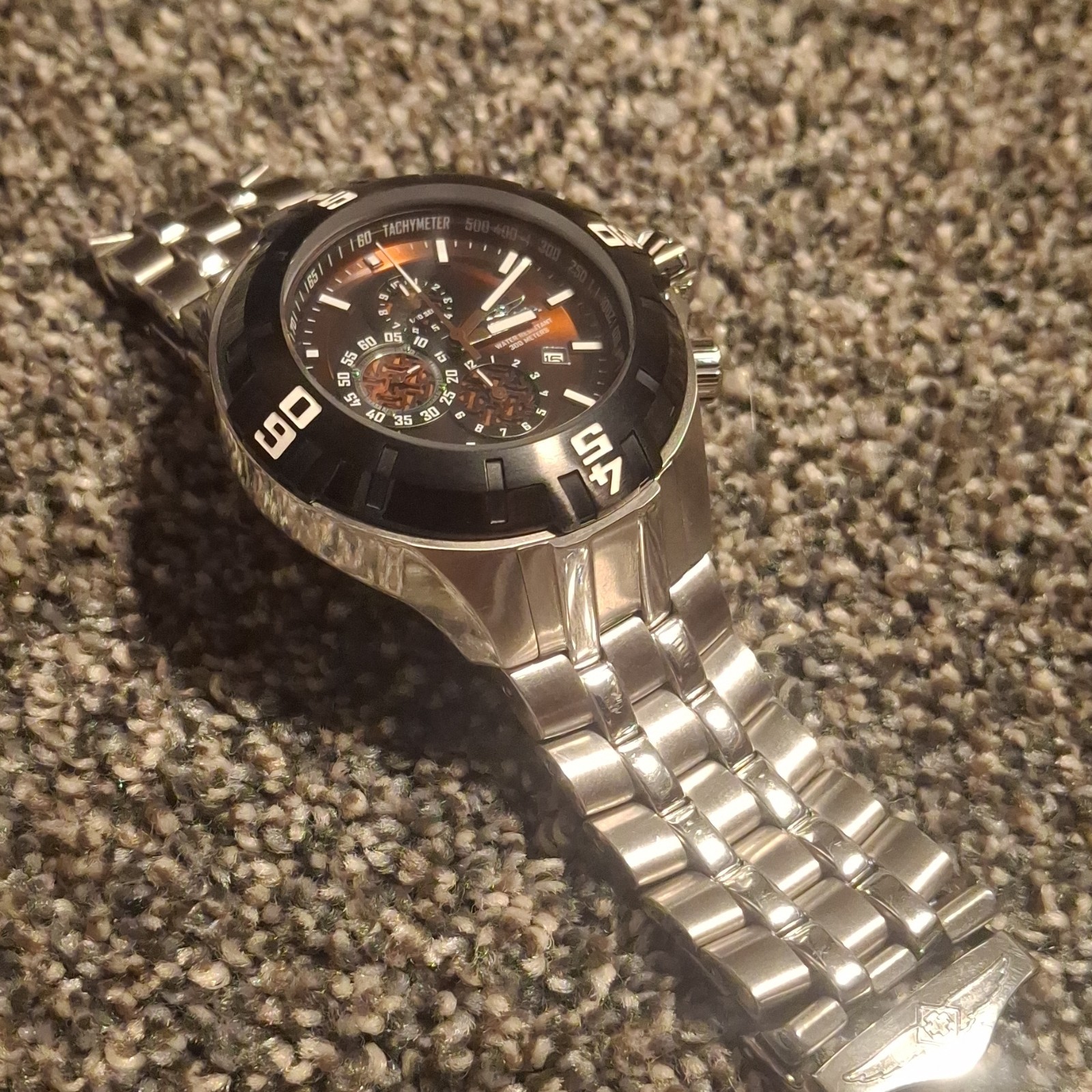 Invicta Men’s Quartz Chronograph 300m SS Black/Orange Dial Silver Bracelet