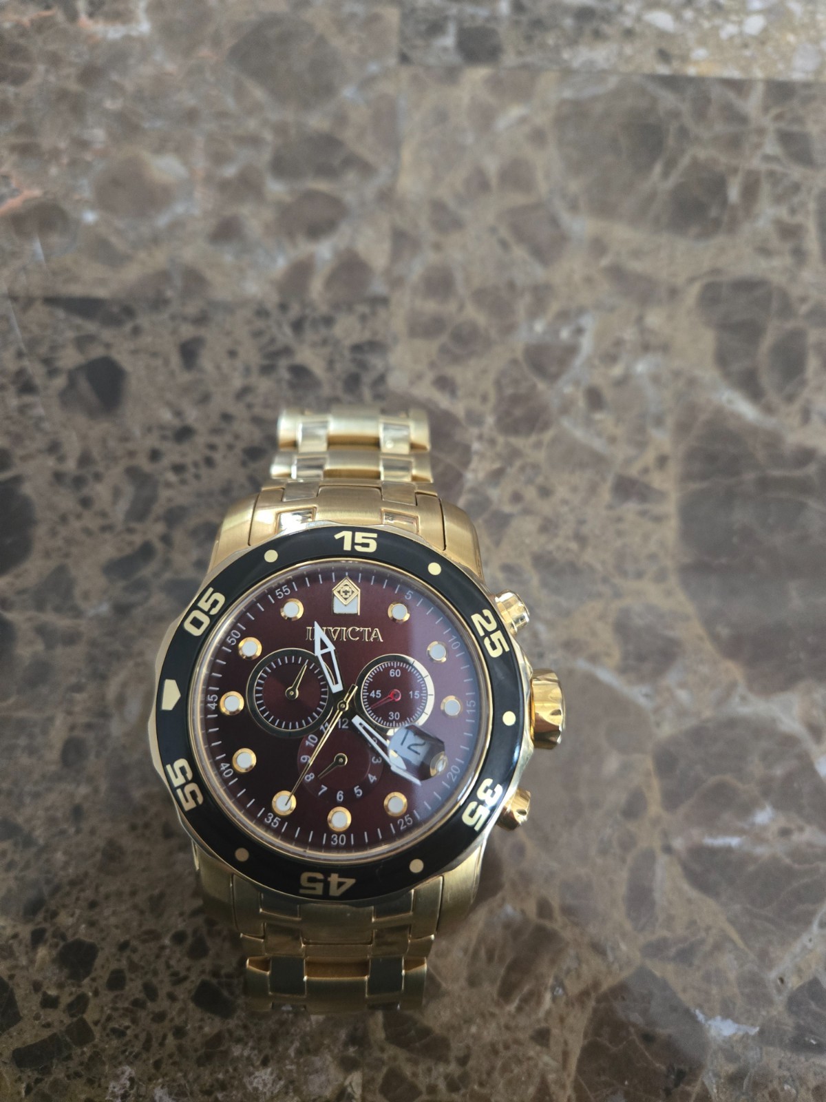 invicta pro diver 50 mm gold with brown bezel