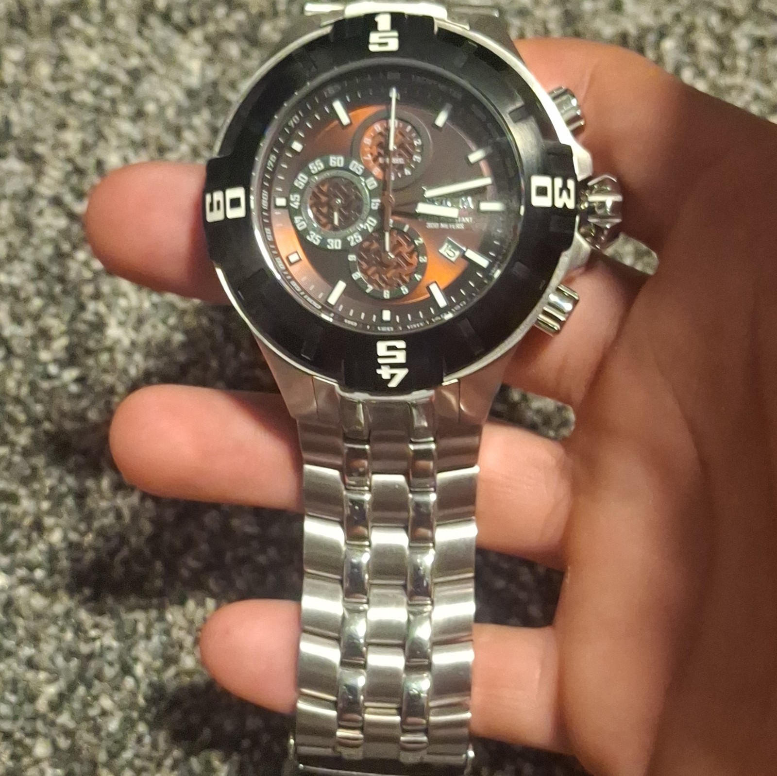 Invicta Men’s Quartz Chronograph 300m SS Black/Orange Dial Silver Bracelet