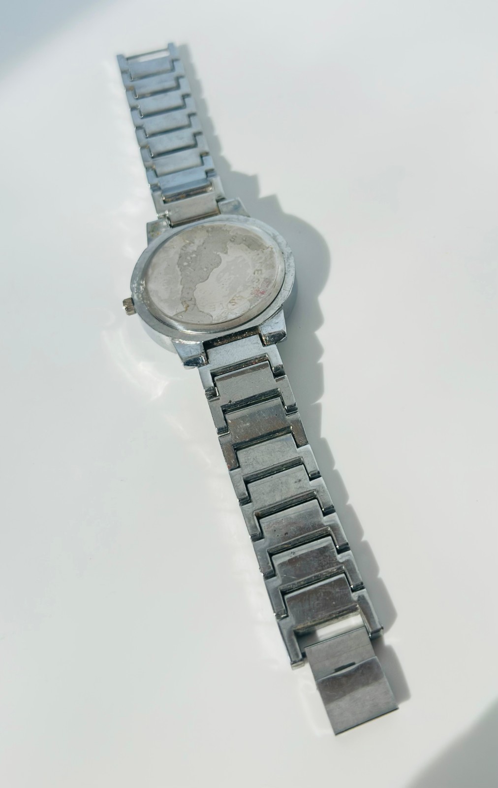 Used Kunda quartz watch a silver-tone metal band and a white dial needs Battery