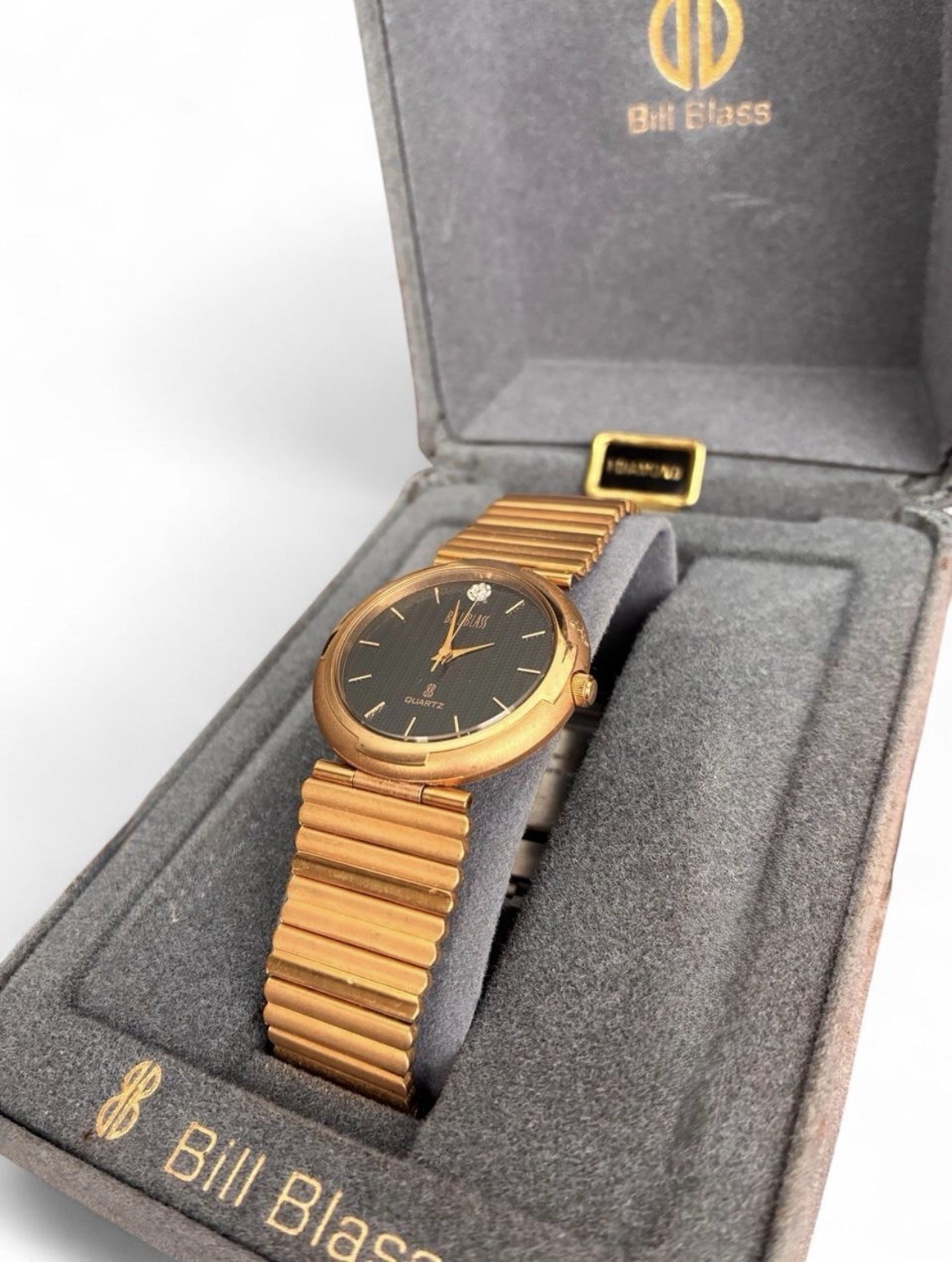 Bill Blass Womens Quartz Dress Watch Gold Tone Bracelet Black Textured Dial Box