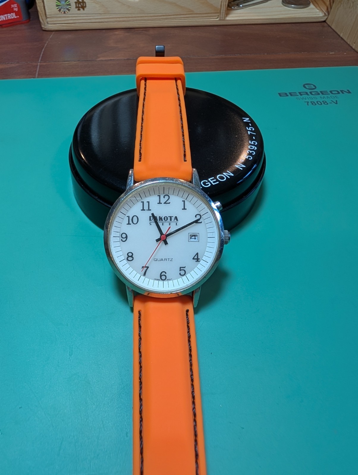 Dakota Moon-Glow Quartz Analog Watch Date Luminous White Dial Orange Strap
