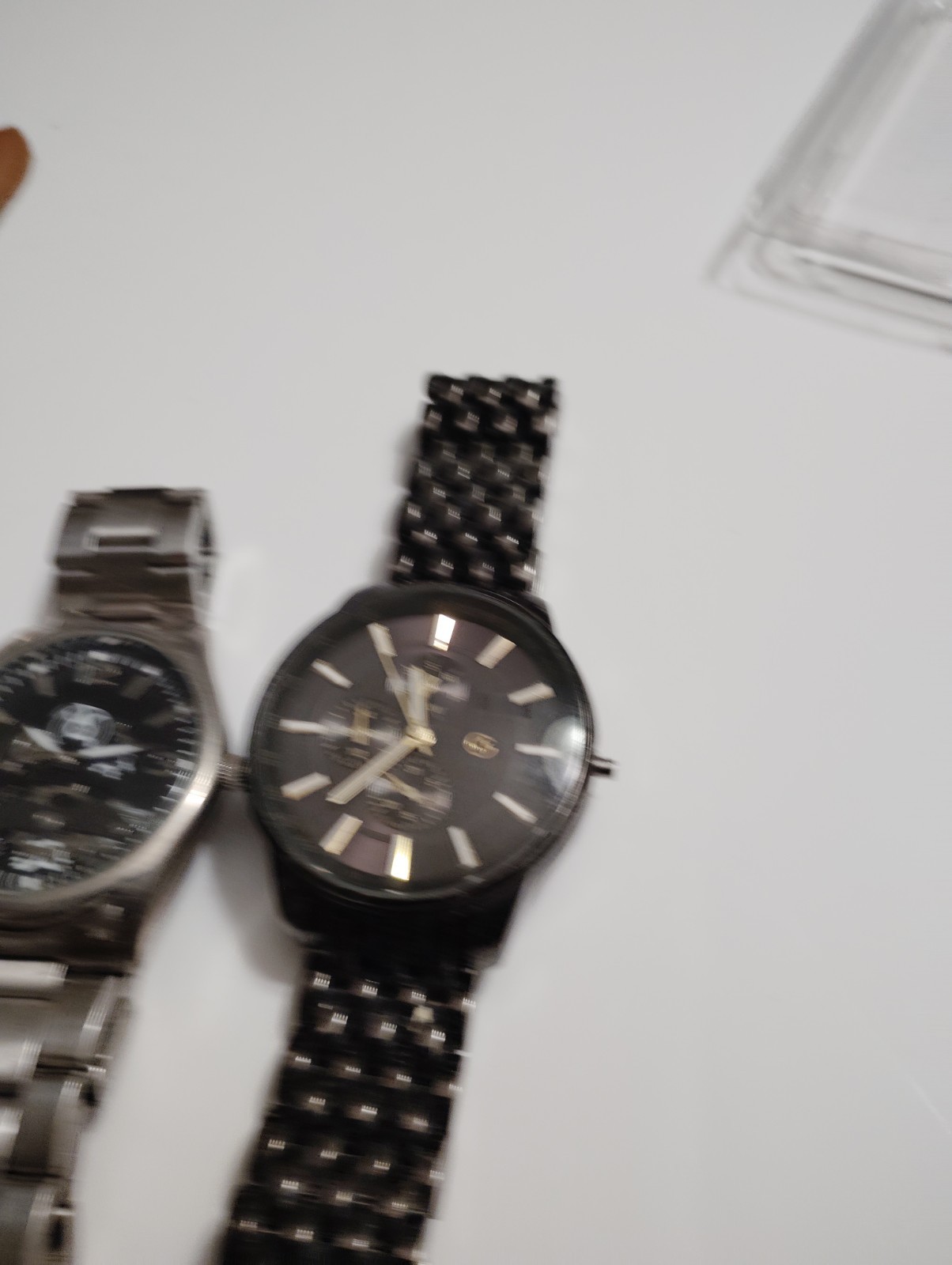 Collection of four fashion watches with various strap styles