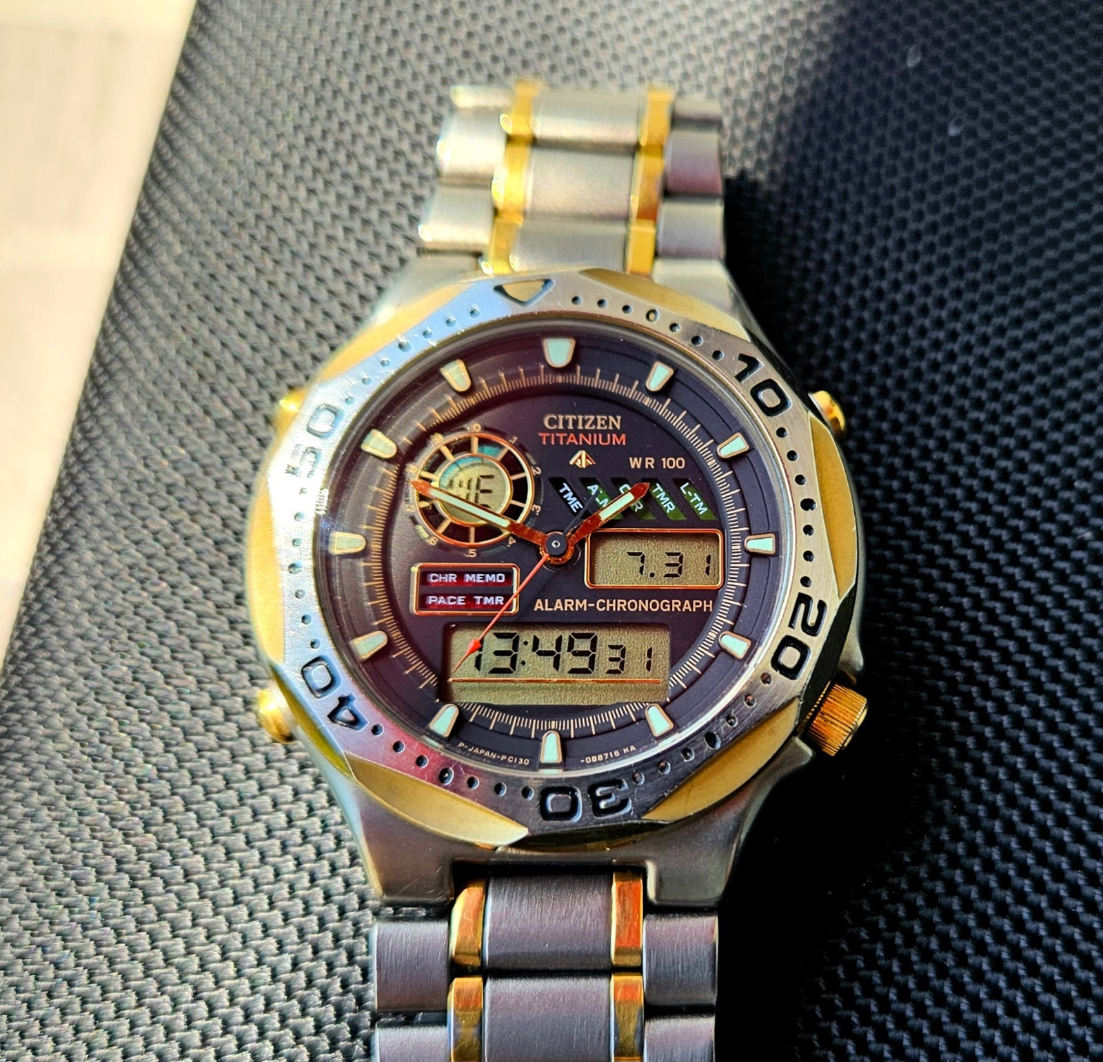 Citizen Promaster Pace Timer Titanium WR100 C130-089685 two-tone gold accents