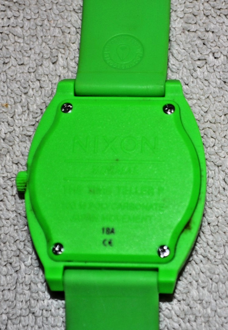 Nixon Time Teller P watch featuring a vibrant green polycarbonate case and strap